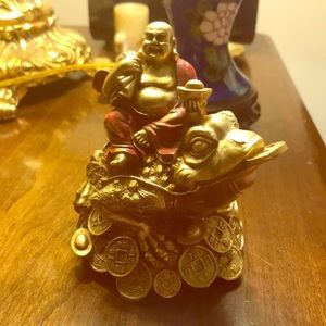 Buddha on the three leg frog figurine. Plastic.New